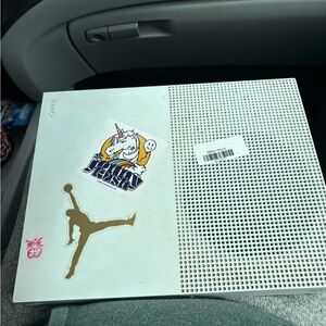 Microsoft Gold and White Gaming Console